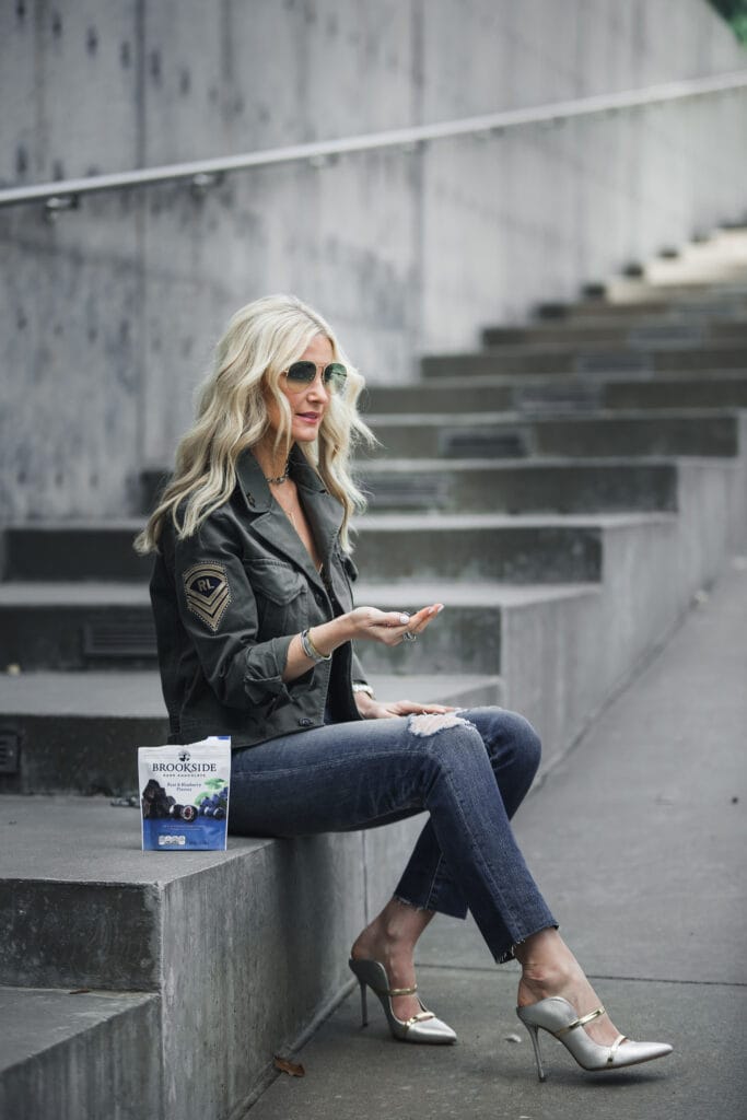 Dallas fashion blogger wearing army jacket and ripped jeans