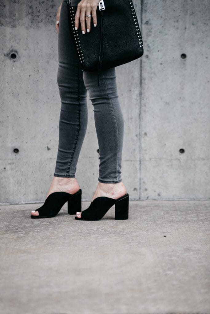 Gray skinny jeans and black suede mules