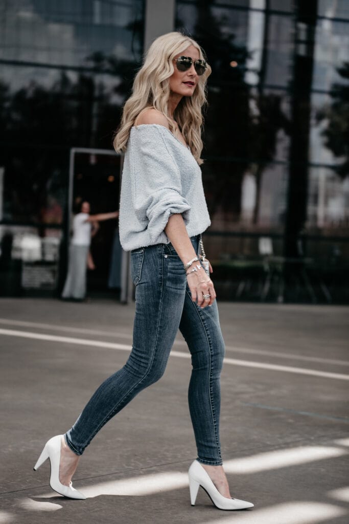 Dallas fashion blogger wearing blue jeans and white pumps