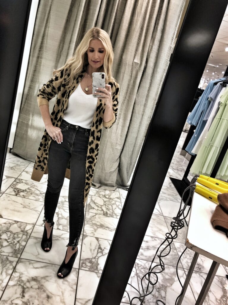 Dallas woman wearing a leopard cardigan and black jeans