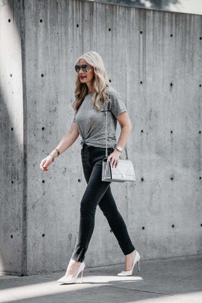Dallas style blogger wearing black jeans and white pumps