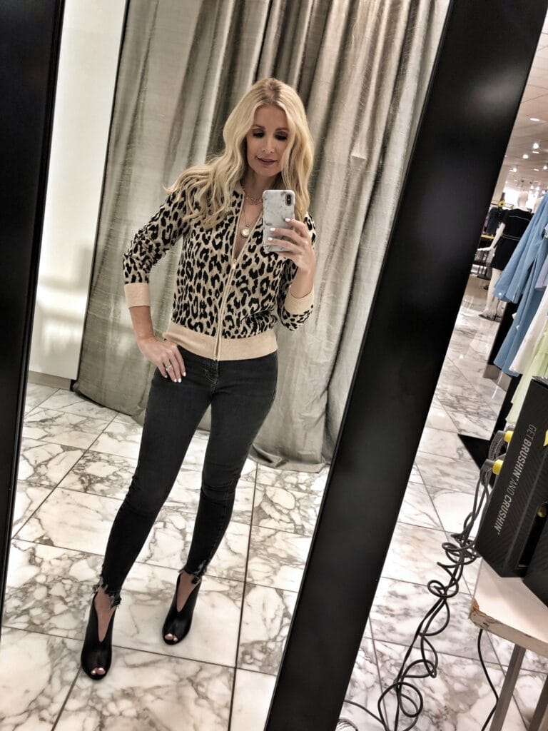 Dallas woman wearing a leopard sweater and Topshop jeans