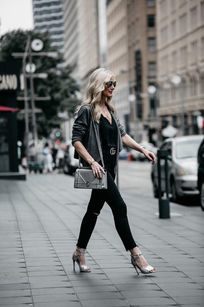 Dallas fashion blogger wearing Dior handbag and black jeans 