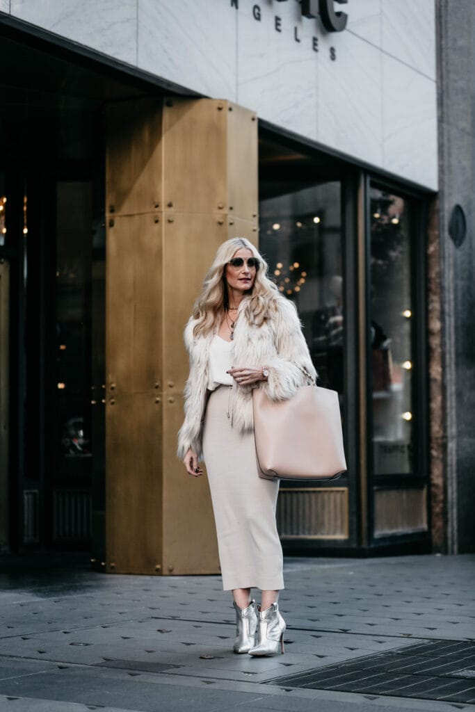 Dallas fashion blogger wearing a midi skirt and Veronica Beard Booties