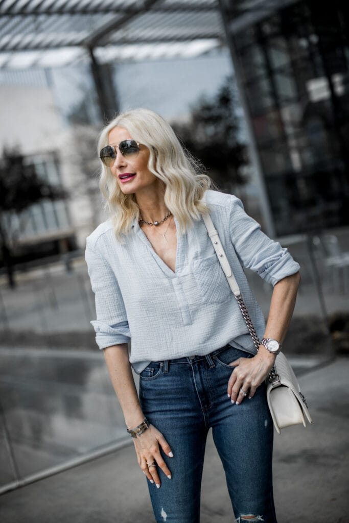 Dallas fashion blogger wearing blue top and blue denim jeans by Paige