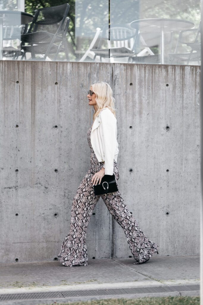 Dallas fashion blogger carrying Gucci bag and wearing white leather jacket