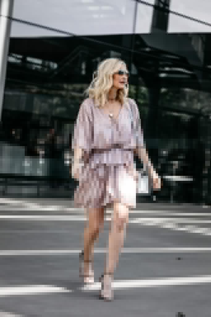 Dallas blogger wearing a pink metallic dress and silver heels
