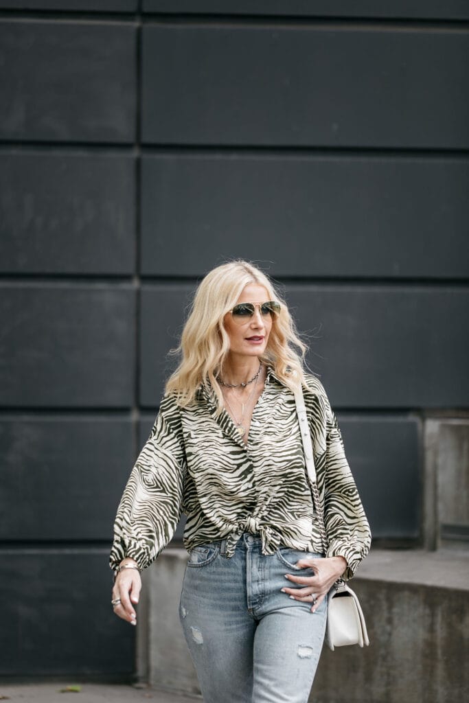 Dallas blogger wearing zebra print top and jeans 