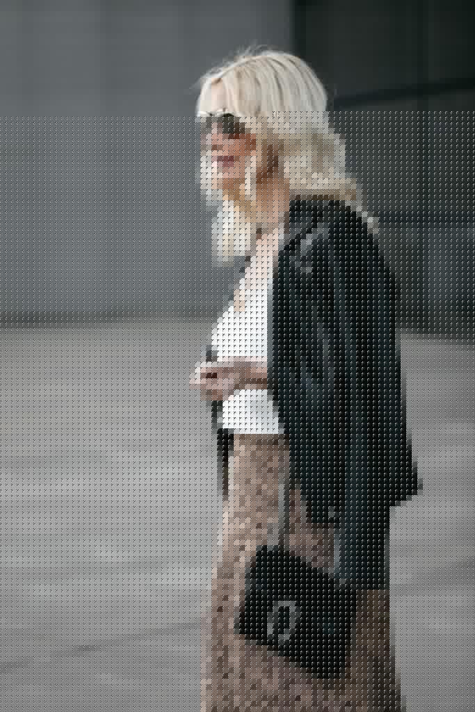 Dallas fashion blogger wearing a black leather jacket and a leopard midi skirt