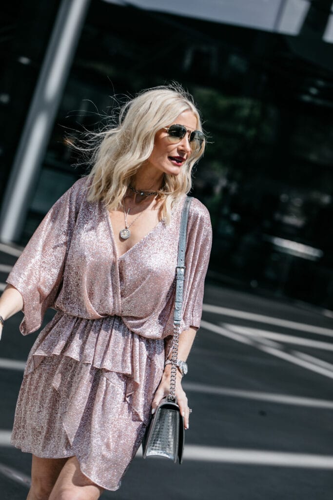 Dallas blogger wearing a pink mini dress and coin necklace 