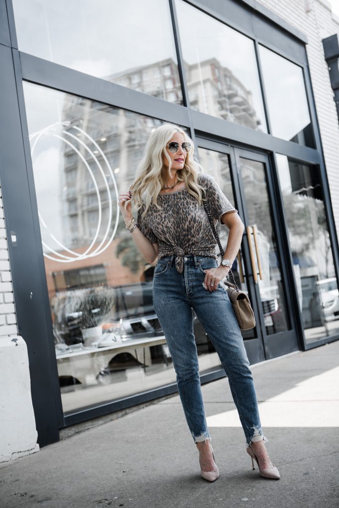 Dallas blogger wearing Agolde jeans and a leopard tee shirt 