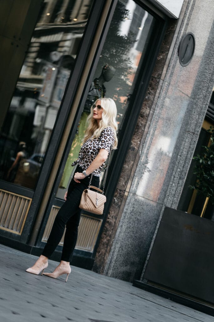 Dallas influencer wearing Jimmy Choo pumps and a leopard tee
