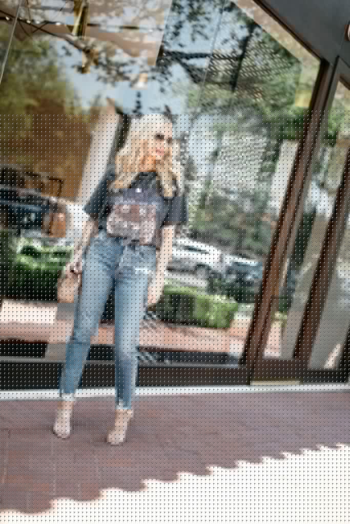 Dallas blogger wearing an Anine Bing graphic tee and Agolde jeans