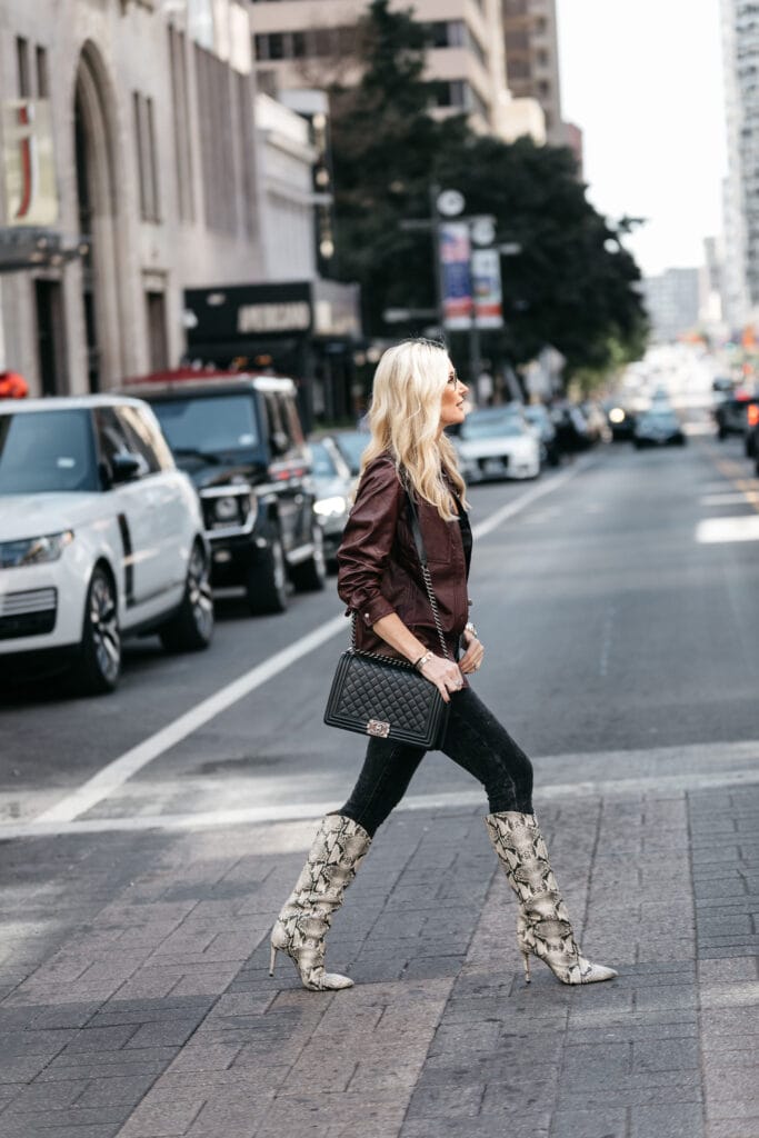 Dallas blogger wearing Schutz Snake Print boots