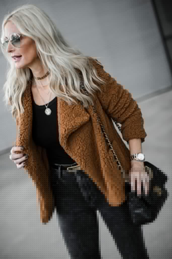Dallas influencer wearing a Gucci belt and a camel teddy coat