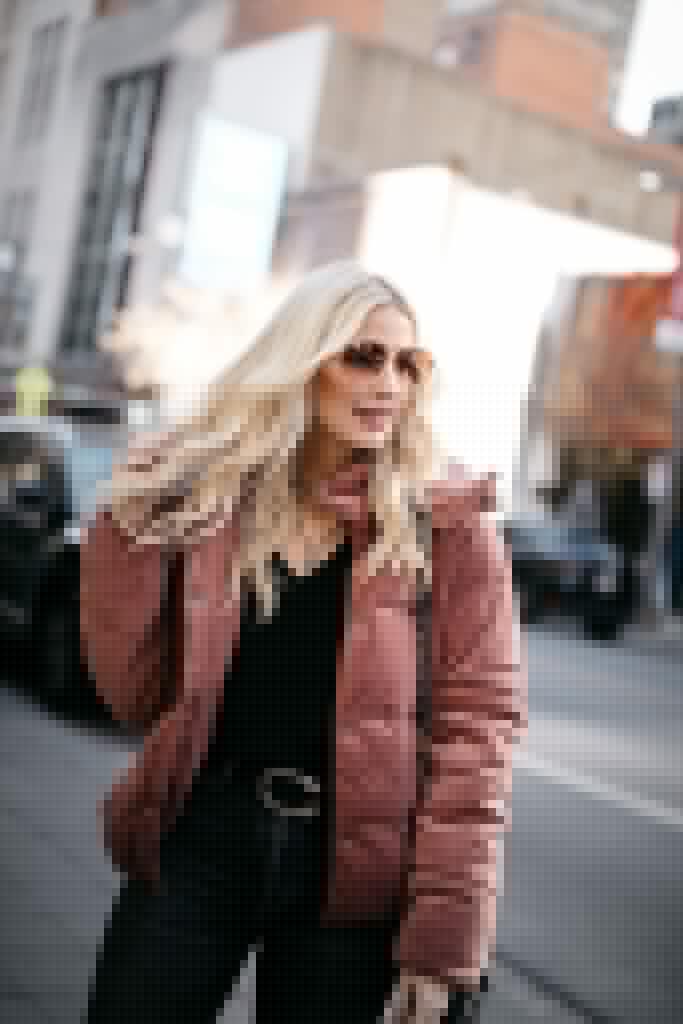 Fashion blogger wearing a winter jacket and a Gucci belt