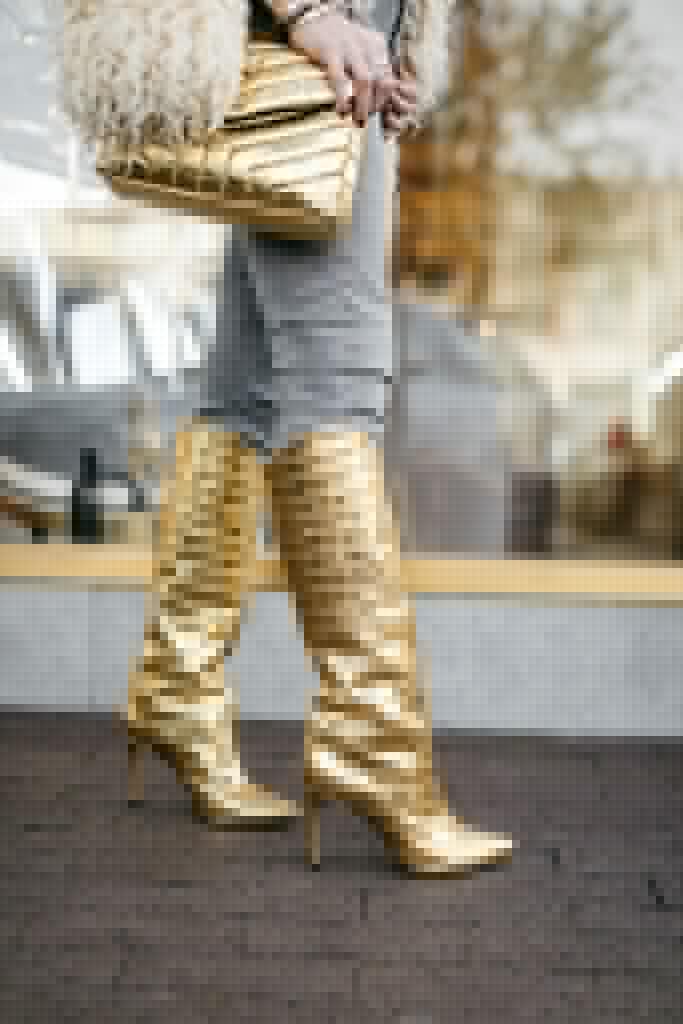 Dallas influencer wearing Schutz gold boots