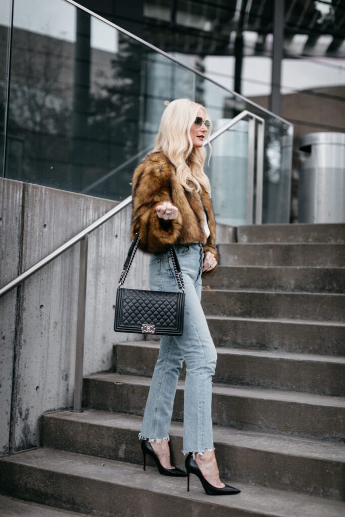 Dallas blogger carrying a Chanel Boy Bag