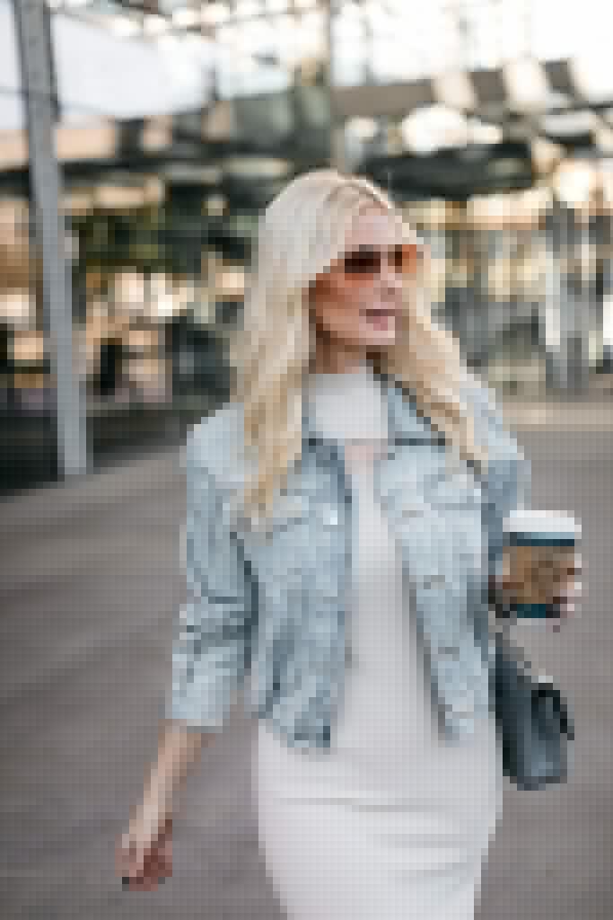 Fashion blogger wearing a nude dress with nude heels