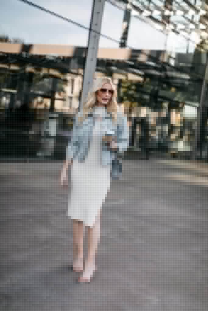 Dallas blogger wearing a denim jacket and a dress