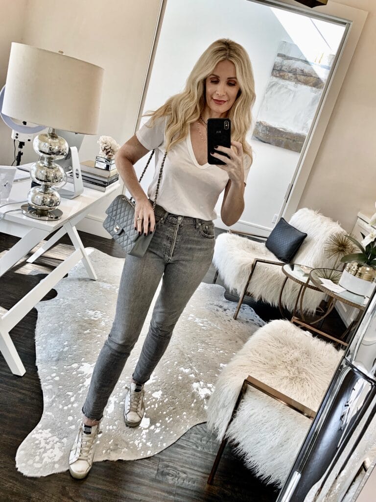 Dallas blogger wearing Agolde jeans and Golden Goose sneakers