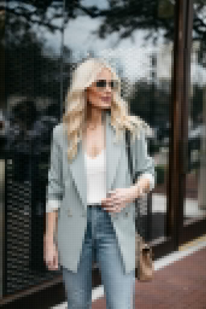 Fashion blogger wearing a white camisole and an oversized blazer