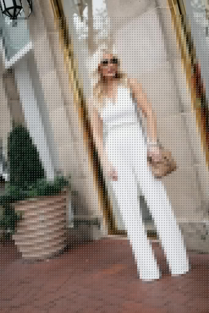 Dallas blogger wearing a white jumpsuit