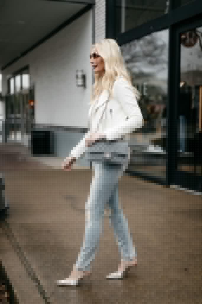 Dallas influencer wearing ripped jeans and carrying a Chanel Flap bag