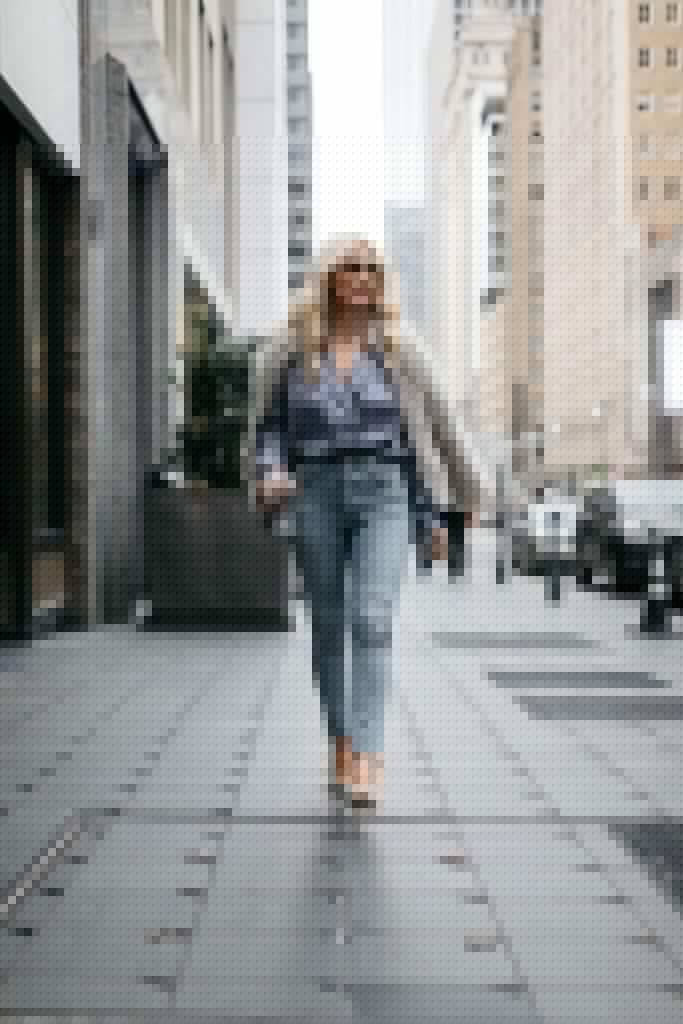 Dallas style blogger wearing a blue bodysuit and blue jeans