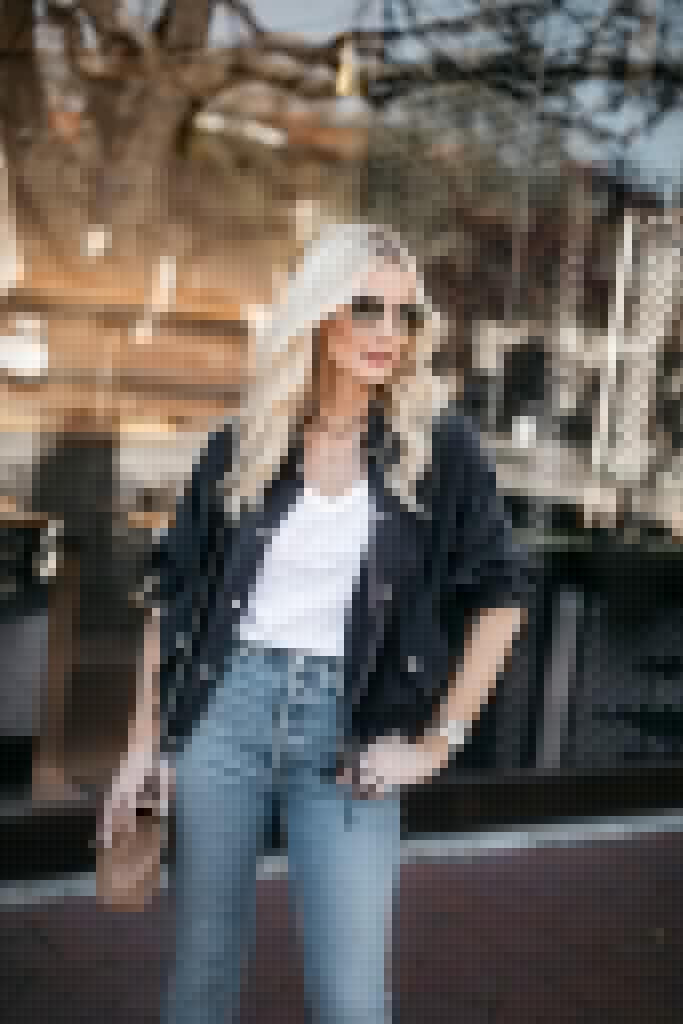 Dallas style blogger wearing a grey utility jacket and a white tee