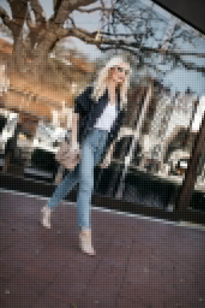 Fashion blogger wearing high-waisted jeans and heels