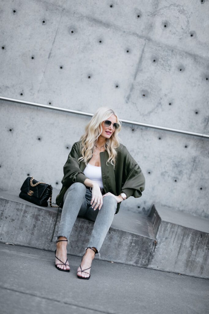 Fashion blogger wearing a jacket and black heels