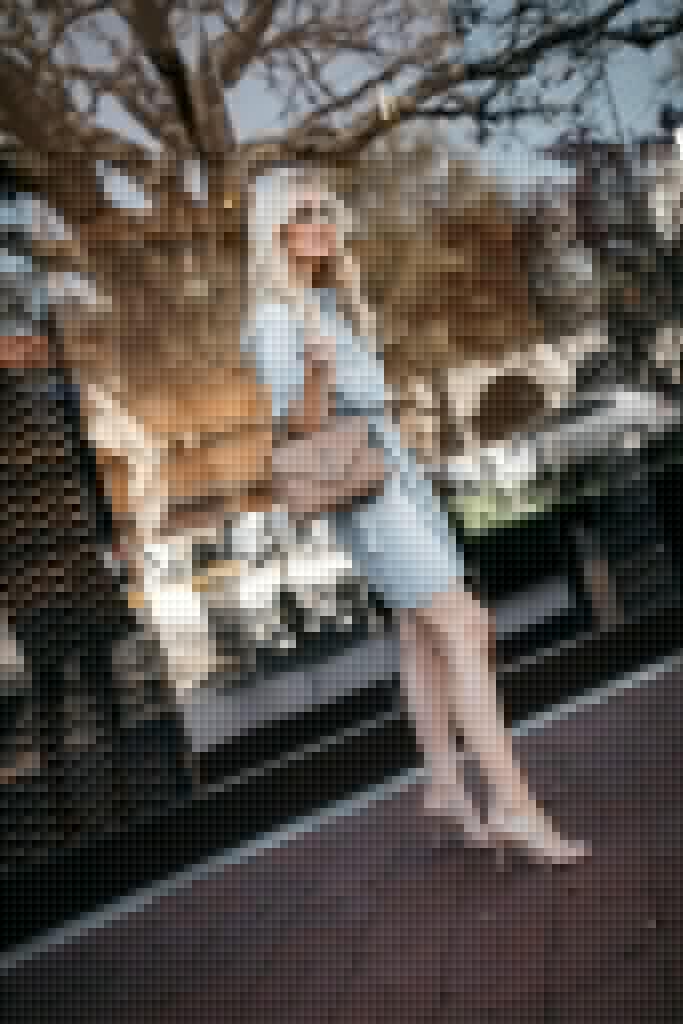 Dallas style blogger wearing a denim dress and a designer handbag