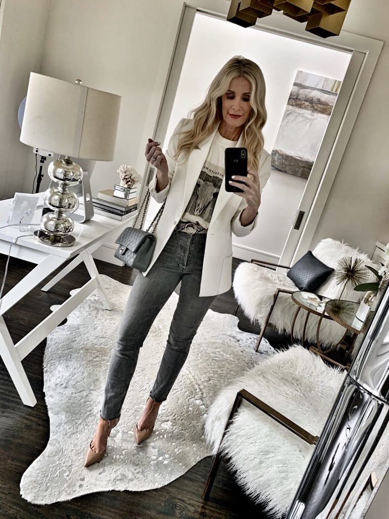 Dallas influencer wearing a white blazer and heels