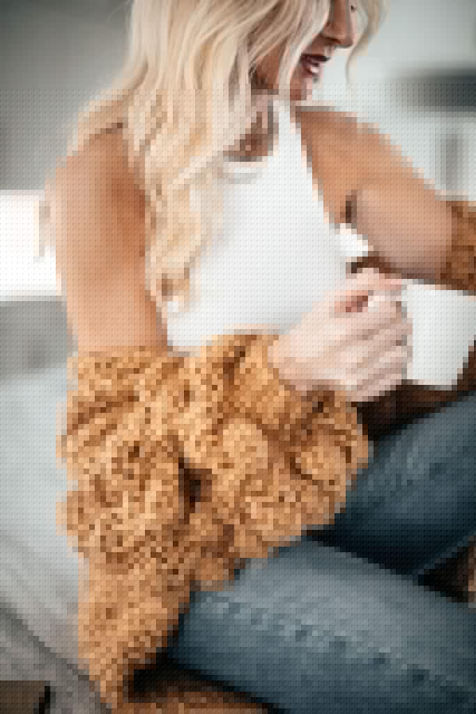 Dallas style blogger wearing a spring cardigan and a white tank