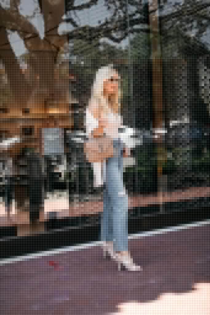 Style blogger wearing a lace bodysuit and straight leg denim