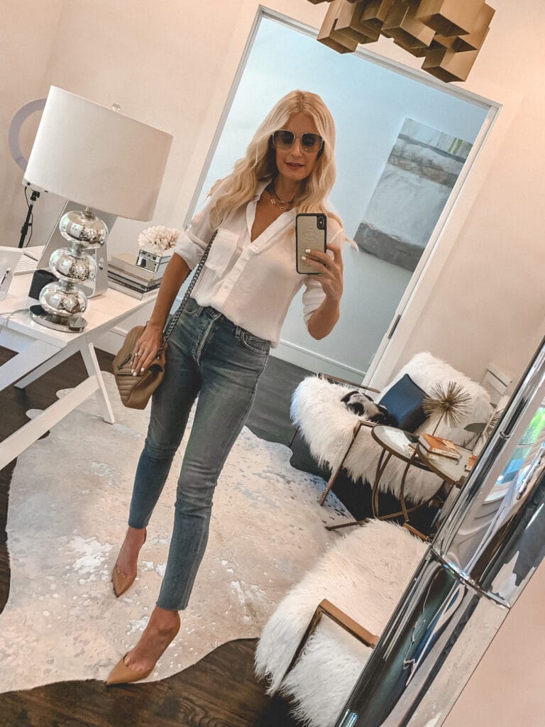 Dallas influencer wearing a white shirt and jeans