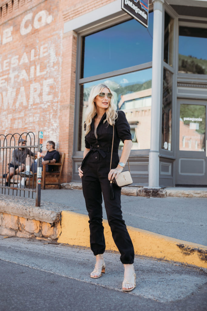 Over 40 blogger wearing a denim jumpsuit