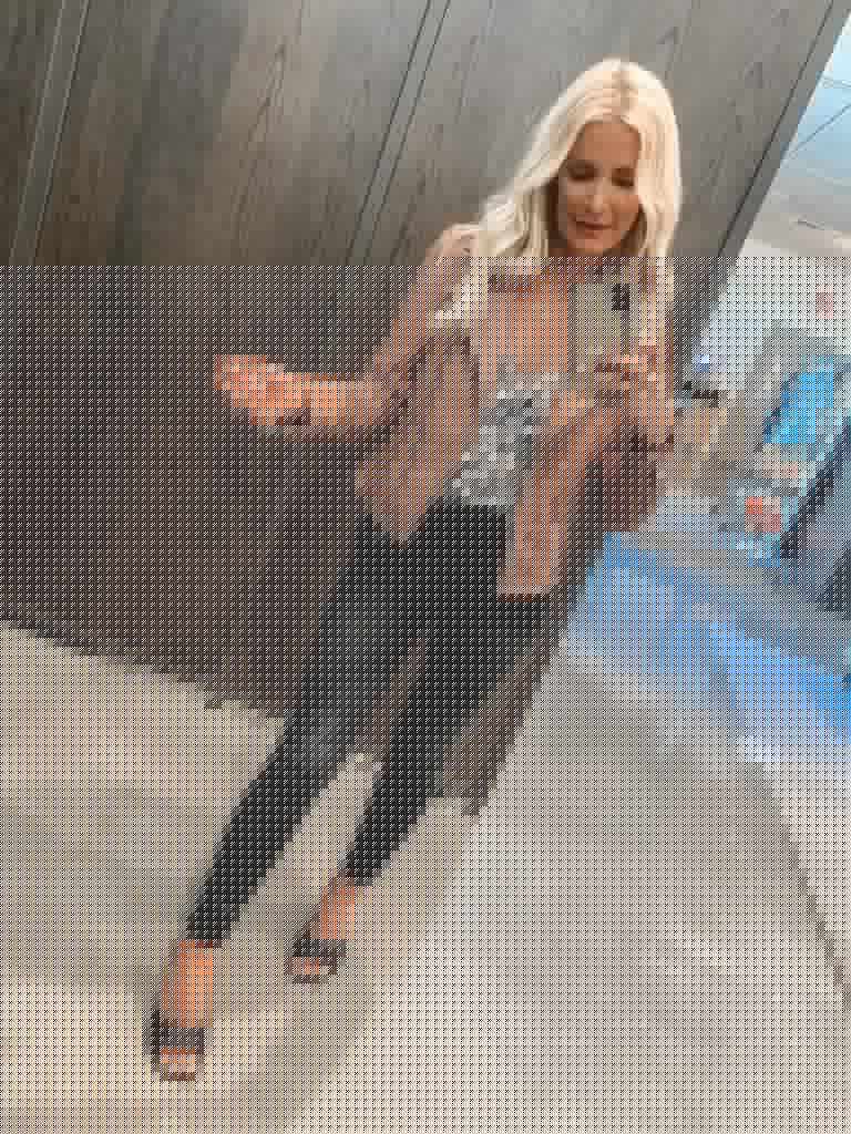 Dallas blogger wearing a tan leather jacket and a zebra print cami