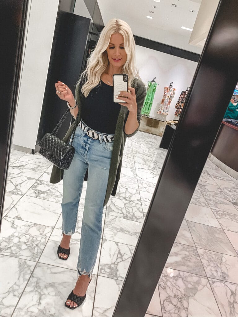 Dallas blogger wearing light wash denim and a long olive green cardigan