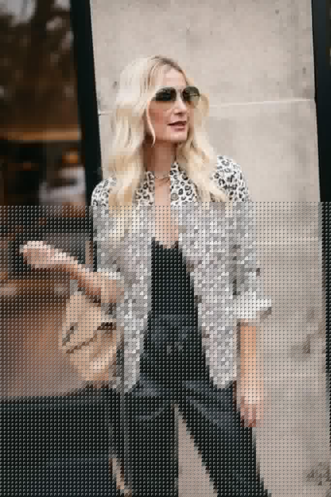 Dallas fashion blogger wearing a white leopard print jacket and black bodysuit