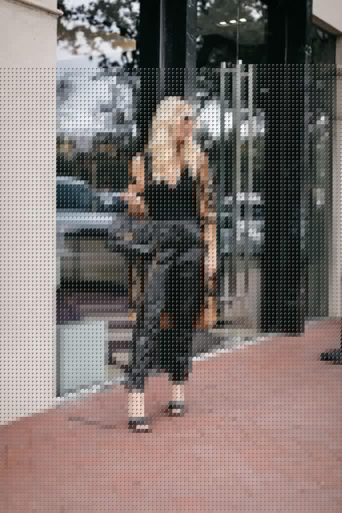 Dallas blogger wearing a rust zebra cardigan and black leather joggers for fall