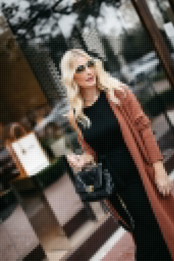 Dallas fashion influencer wearing a rust cardigan and a Chanel handbag in the fall