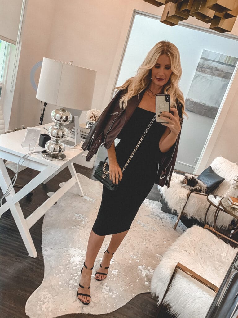 Dallas blogger wearing a black slip dress and a burgundy leather jacket