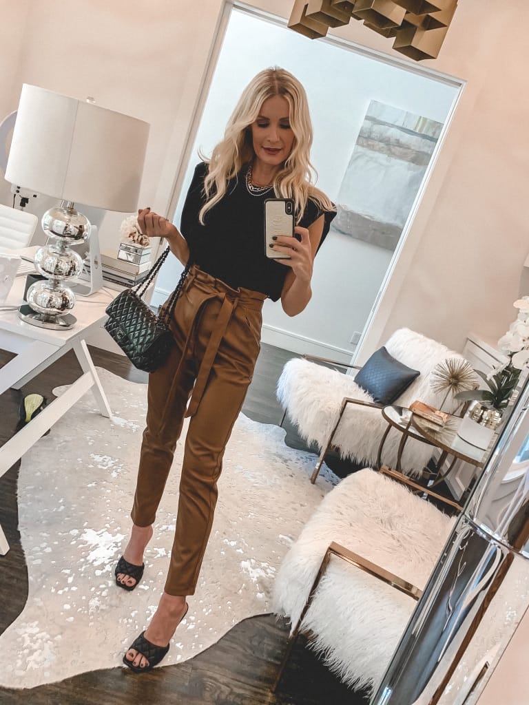 Dallas fashion blogger wearing faux leather pants and a black top