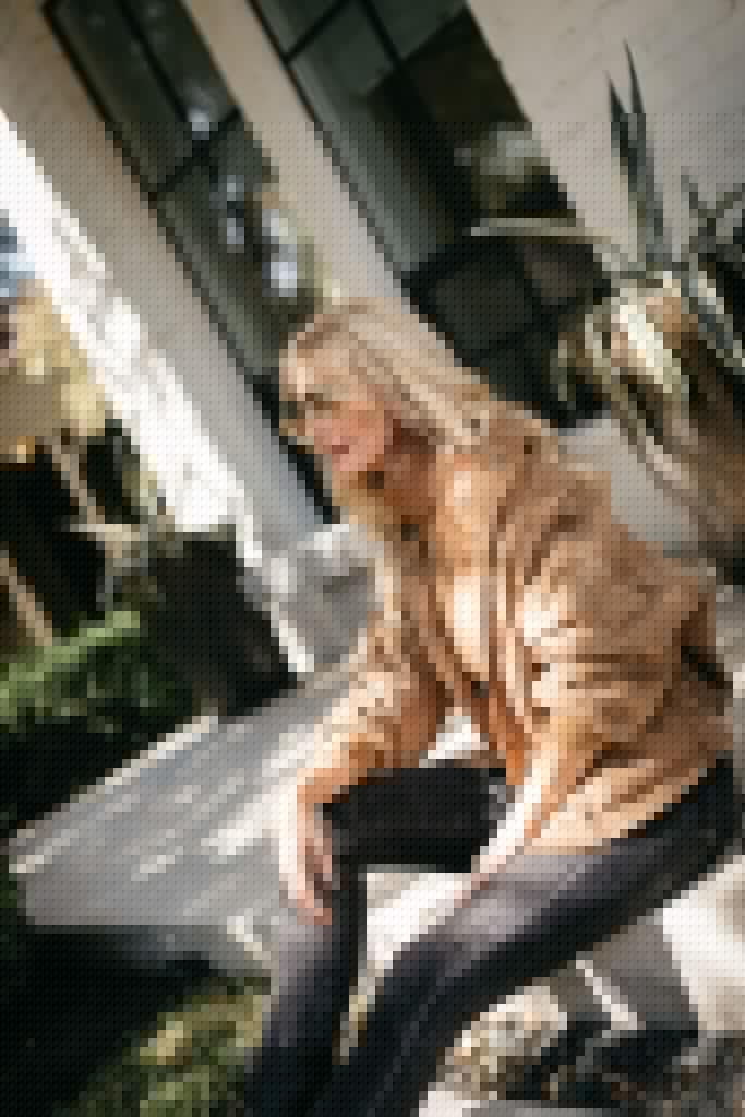 Fashion blogger wearing a neutral fall jacket and a neutral turtleneck sweater