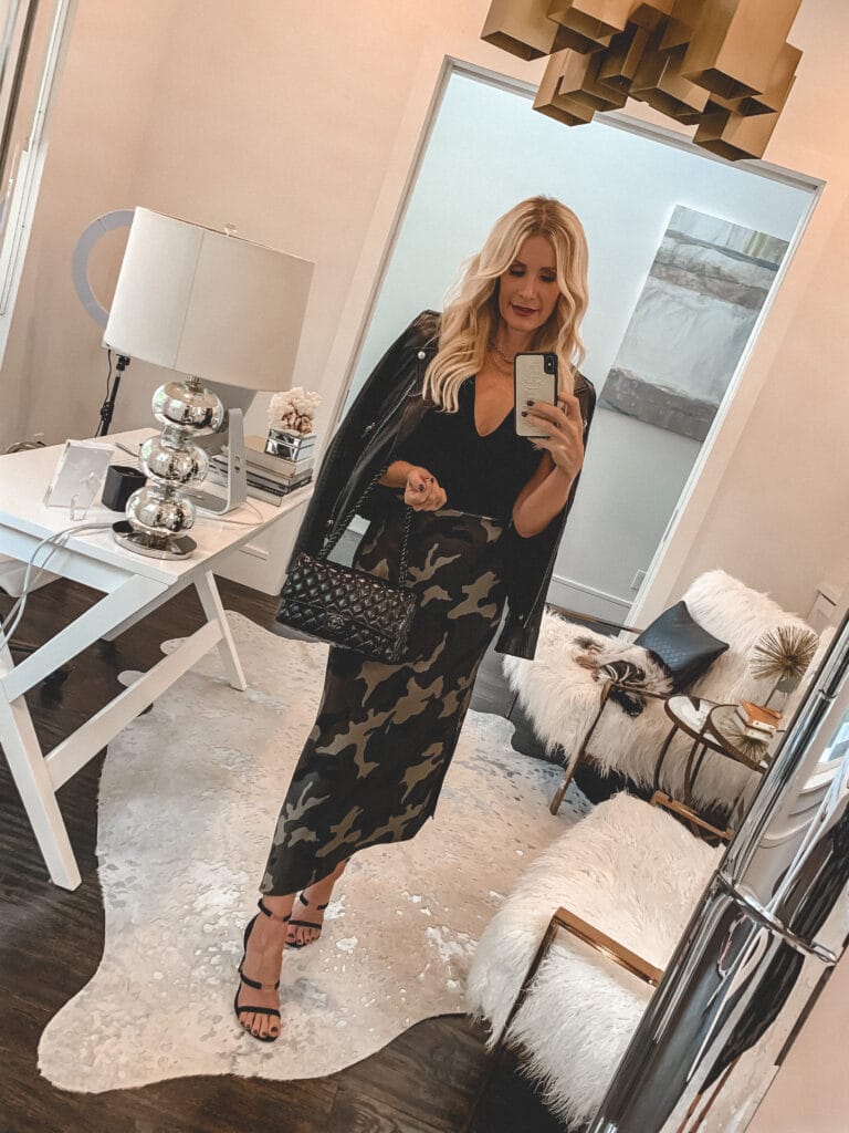 Dallas fashion blogger wearing a camo midi skirt and a black leather Moto jacket