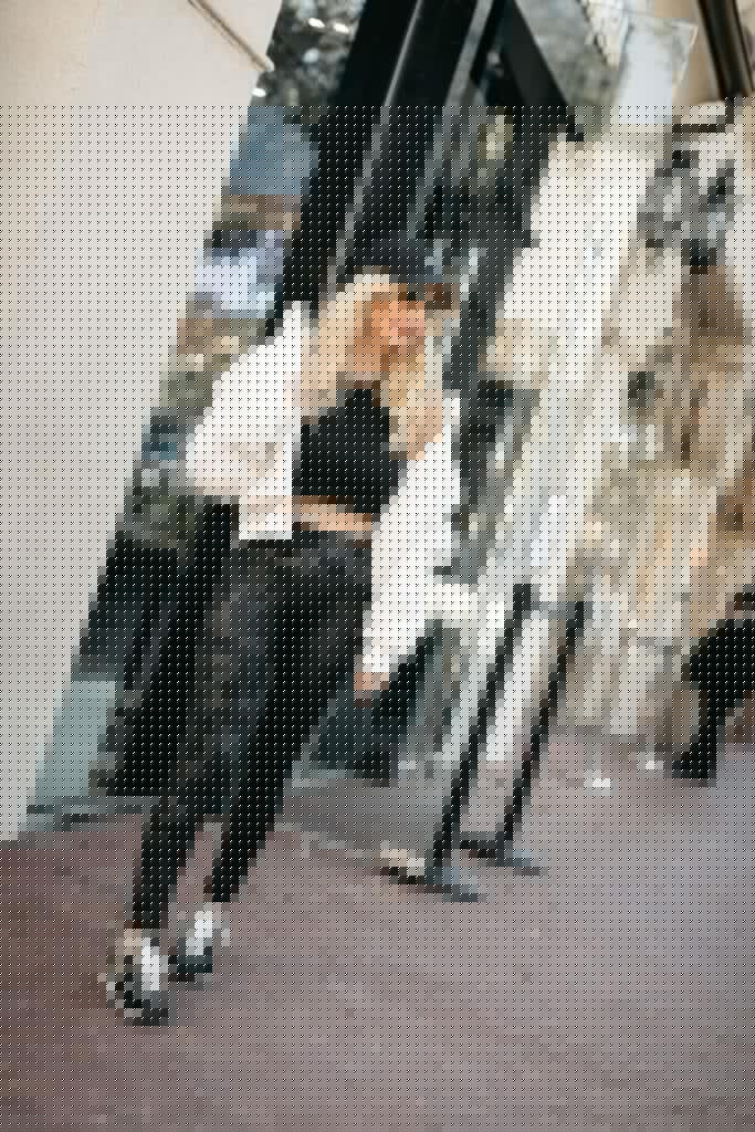 Dallas blogger wearing an affordable faux fur jacket and camo high-waist leggings