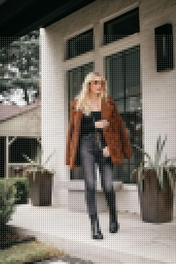 Dallas style blogger wearing a teddy coat and black denim