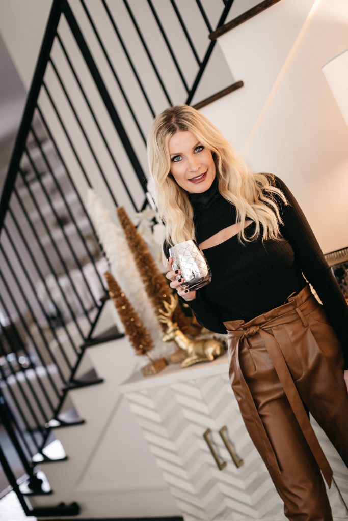 Dallas blogger wearing brown faux leather pants and a cut out black top from Bloomingdales 